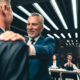 Business leader touching other man's shoulder